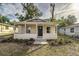 Newly renovated house featuring a front porch and well-manicured landscaping at 638 W Thomas St, Lakeland, FL 33805