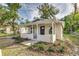 Charming house with a covered porch, newly landscaped yard, and updated exterior at 638 W Thomas St, Lakeland, FL 33805