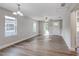 Bright living room with hardwood floors, ceiling fan, and lots of natural light at 638 W Thomas St, Lakeland, FL 33805