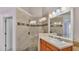 Large bathroom with walk-in shower and double vanity at 649 Grasslands Village Cir, Lakeland, FL 33803