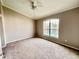 Bright bedroom with carpet flooring and large window offering water views at 649 Grasslands Village Cir, Lakeland, FL 33803