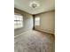 Well-lit bedroom with carpet flooring and neutral wall tones at 649 Grasslands Village Cir, Lakeland, FL 33803