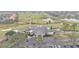 Aerial view of clubhouse with golf course and lake in background at 649 Grasslands Village Cir, Lakeland, FL 33803