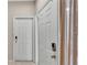 Entryway with two white doors and wood flooring at 649 Grasslands Village Cir, Lakeland, FL 33803