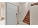 Entryway with white door and staircase at 649 Grasslands Village Cir, Lakeland, FL 33803