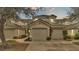 Two-story townhome with attached garage and landscaping at 649 Grasslands Village Cir, Lakeland, FL 33803