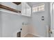 Laundry room with upper cabinets and shelving at 649 Grasslands Village Cir, Lakeland, FL 33803