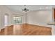 Living room with hardwood floors and access to balcony at 649 Grasslands Village Cir, Lakeland, FL 33803