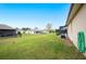 Large grassy backyard with plenty of space to play at 6550 Evergreen Park Dr, Lakeland, FL 33813