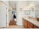 Bright bathroom with a vanity, and view into bedroom at 6550 Evergreen Park Dr, Lakeland, FL 33813