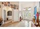 Bright and spacious entryway with tile floors and coat rack at 6550 Evergreen Park Dr, Lakeland, FL 33813