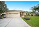 One story house with attached garage and manicured lawn at 6550 Evergreen Park Dr, Lakeland, FL 33813