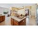 Large kitchen island with breakfast bar and view to Gathering room at 6550 Evergreen Park Dr, Lakeland, FL 33813