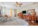 Comfortable main bedroom with wood floors and ensuite bathroom at 6550 Evergreen Park Dr, Lakeland, FL 33813