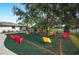 Community playground with playset and colorful play features at 6550 Evergreen Park Dr, Lakeland, FL 33813