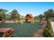 Community playground with playset, swings, and picnic tables at 6550 Evergreen Park Dr, Lakeland, FL 33813