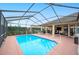 Large screened pool with patio and backyard views at 6550 Evergreen Park Dr, Lakeland, FL 33813