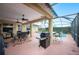 Relaxing screened pool area with patio furniture and grill at 6550 Evergreen Park Dr, Lakeland, FL 33813