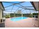 Inviting screened-in pool and patio area at 6550 Evergreen Park Dr, Lakeland, FL 33813