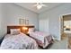 Guest bedroom with twin beds and access to another room at 7068 Island Lake Ln, Lakeland, FL 33813