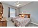 Guest bedroom with twin beds and ceiling fan at 7068 Island Lake Ln, Lakeland, FL 33813