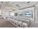 Wedding ceremony room with lake view and white chairs at 7068 Island Lake Ln, Lakeland, FL 33813