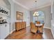 Formal dining room with hardwood floors and a built-in wine rack at 7068 Island Lake Ln, Lakeland, FL 33813