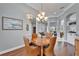 Round dining table with four chairs situated in front of a window at 7068 Island Lake Ln, Lakeland, FL 33813