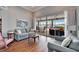 Gathering room with hardwood floors, sofas, and sliding glass doors leading to the outdoors at 7068 Island Lake Ln, Lakeland, FL 33813