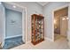 Spacious hallway with built-in curio cabinet and access to other rooms at 7068 Island Lake Ln, Lakeland, FL 33813