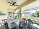 Spacious covered patio with dining area and backyard view at 8 Sawfish Ln, Kissimmee, FL 34759