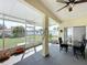 Covered patio with dining set and screened enclosure at 8 Sawfish Ln, Kissimmee, FL 34759