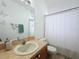 Bathroom with shower/tub combo, toilet and vanity with single sink at 8 Sawfish Ln, Kissimmee, FL 34759