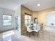 Bright breakfast nook with glass table and chairs, near the kitchen at 8 Sawfish Ln, Kissimmee, FL 34759