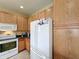 White appliances and oak cabinets highlight this well-equipped kitchen at 8 Sawfish Ln, Kissimmee, FL 34759