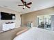 Main bedroom with sliding doors to private patio at 8 Sawfish Ln, Kissimmee, FL 34759