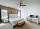 Main bedroom with ceiling fan, plush carpet and access to patio at 8 Sawfish Ln, Kissimmee, FL 34759