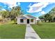 Newly constructed farmhouse-style home with a welcoming front porch at 825 S Seminole Ave, Fort Meade, FL 33841