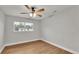 Spacious bedroom with wood-look floors and a window at 865 S 9Th Ave, Bartow, FL 33830