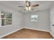 Bedroom with ceiling fan, wood-look flooring, and neutral walls at 865 S 9Th Ave, Bartow, FL 33830