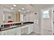 Elegant bathroom with a granite countertop, double sink vanity, and large mirror at 875 Hanover Way, Lakeland, FL 33813