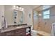 Bathroom with granite vanity, shower, and toilet at 875 Hanover Way, Lakeland, FL 33813