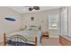 Well-lit bedroom with a double bed and wooden furniture at 875 Hanover Way, Lakeland, FL 33813