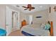 Bedroom with a double bed, ceiling fan, and dresser at 875 Hanover Way, Lakeland, FL 33813