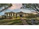 Single-story home with a classic design, landscaping, and walkway at 875 Hanover Way, Lakeland, FL 33813