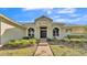 Inviting home exterior with attractive landscaping and walkway at 875 Hanover Way, Lakeland, FL 33813