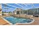 Relaxing screened pool and spa with stone accents at 875 Hanover Way, Lakeland, FL 33813