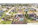 Aerial view showcasing a house's backyard pool and neighborhood at 6714 Highlands Creek Loop, Lakeland, FL 33813