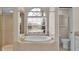 Bathroom boasts a large soaking tub and walk-in shower at 6714 Highlands Creek Loop, Lakeland, FL 33813