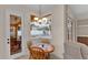 Cozy breakfast nook with wood table and chairs, overlooking the pool at 6714 Highlands Creek Loop, Lakeland, FL 33813